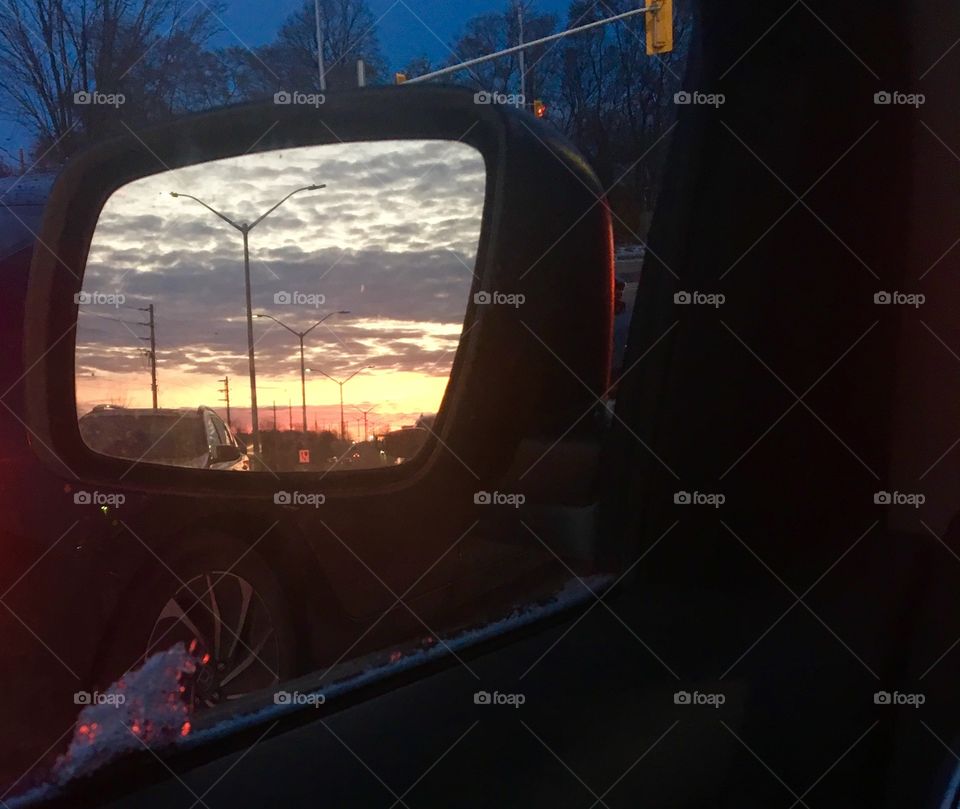 Sunset in a car mirror