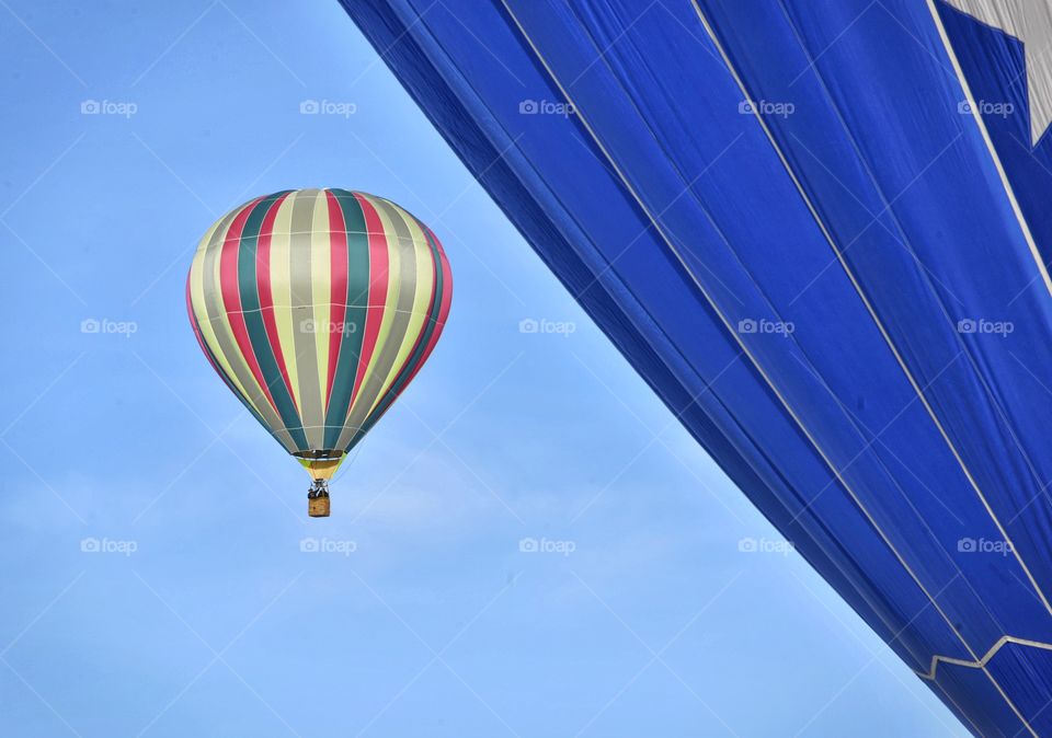 A hot air balloon festival in the winter creates a colorful scene. Stripes make this image pop!