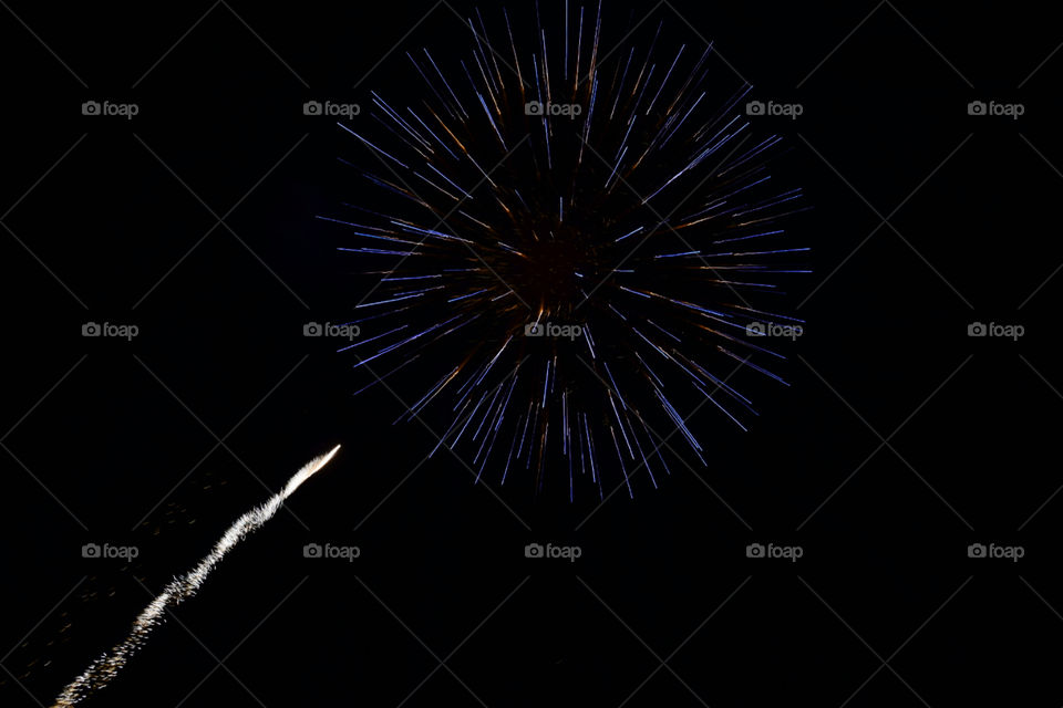 blue firework with white star