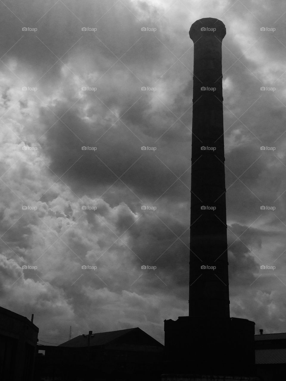 Smokestack and storm clouds
