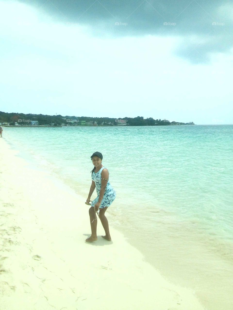 she is having do much fun with her mother an she can't wait to get in the water just can't wait.