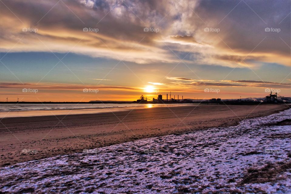 Sunrise on a snowy beach