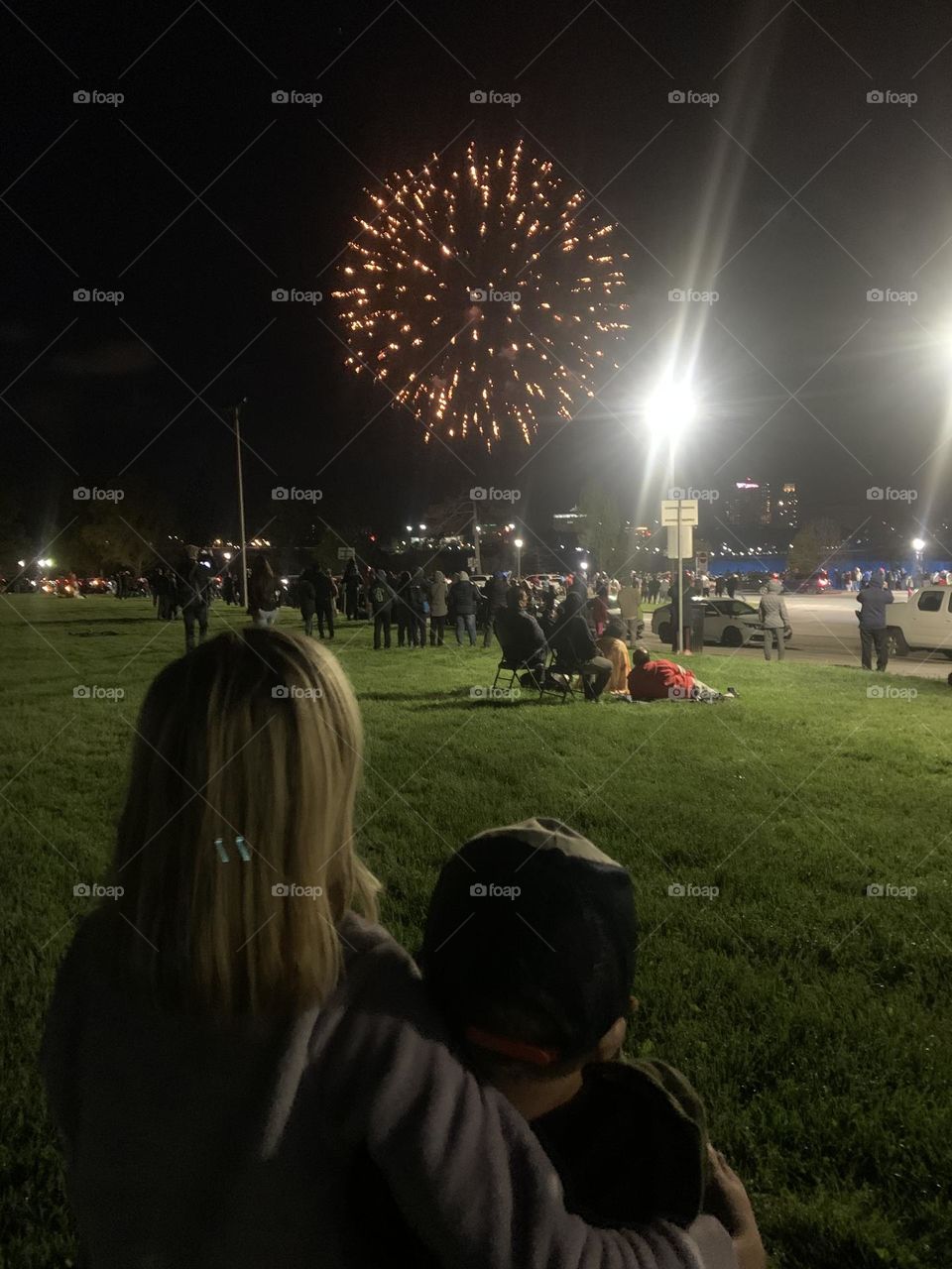 People watching firework display 