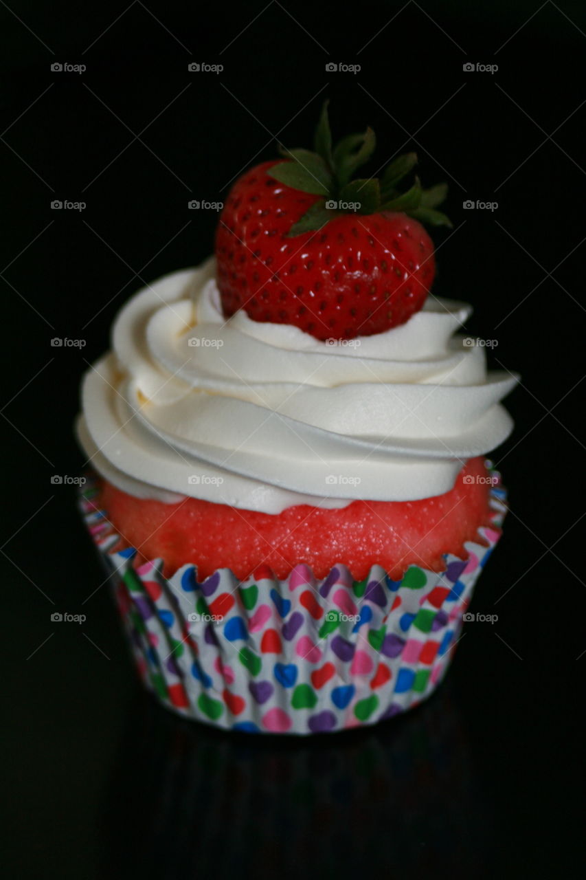 Strawberry and Jello Cupcake with Whipped Cream and Strawberry Garnish