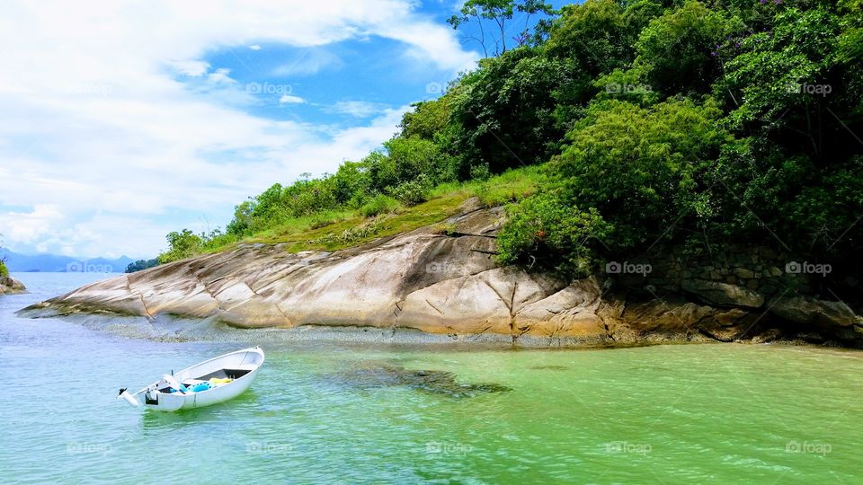 Boat trip to a desert island. Cristal water and a relaxing time to enjoy nature.