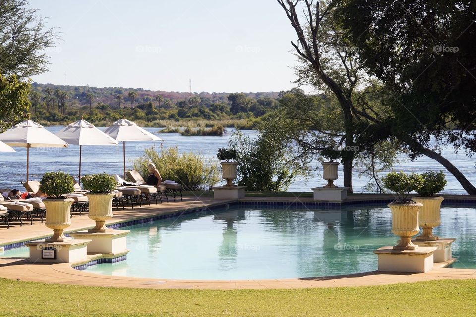 View of Zambezi River and Royal Livingston hotel pool in Zambia 