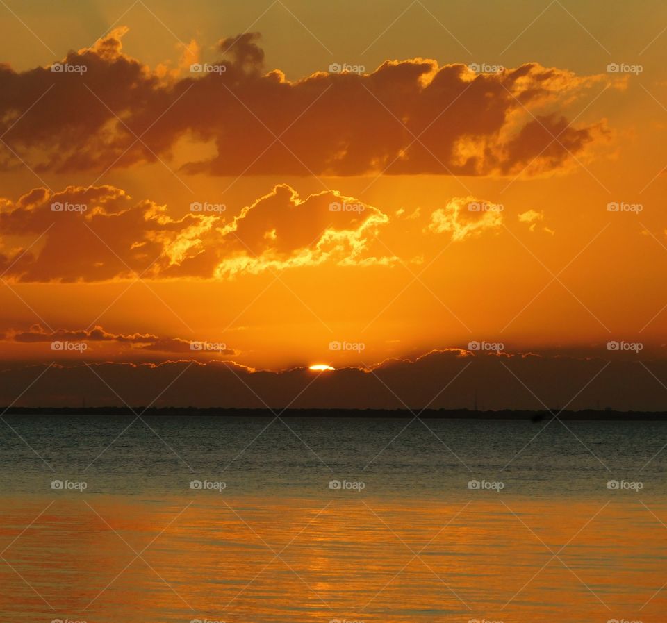 Amazing Silhouettes! The sun is like a great big romantic, inspirational fire in the sky. Brilliant streaks of yellow, orange, gold, overcome the spacious sky. The sky resembled a prism; all the colors blended perfectly together. It's as if the colors and intensity of the light is just right!