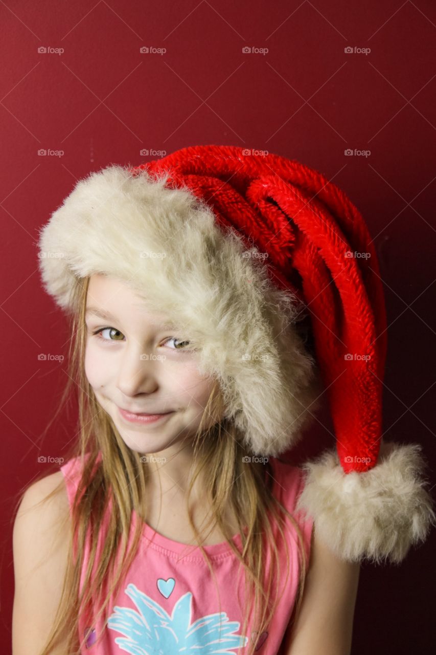 Portrait of a girl wearing Christmas hat