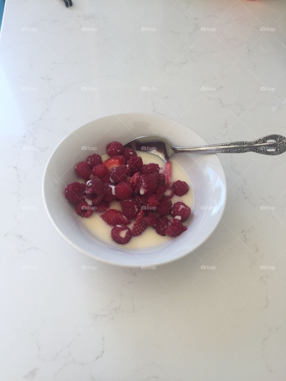 Bowl of berries with custard cream