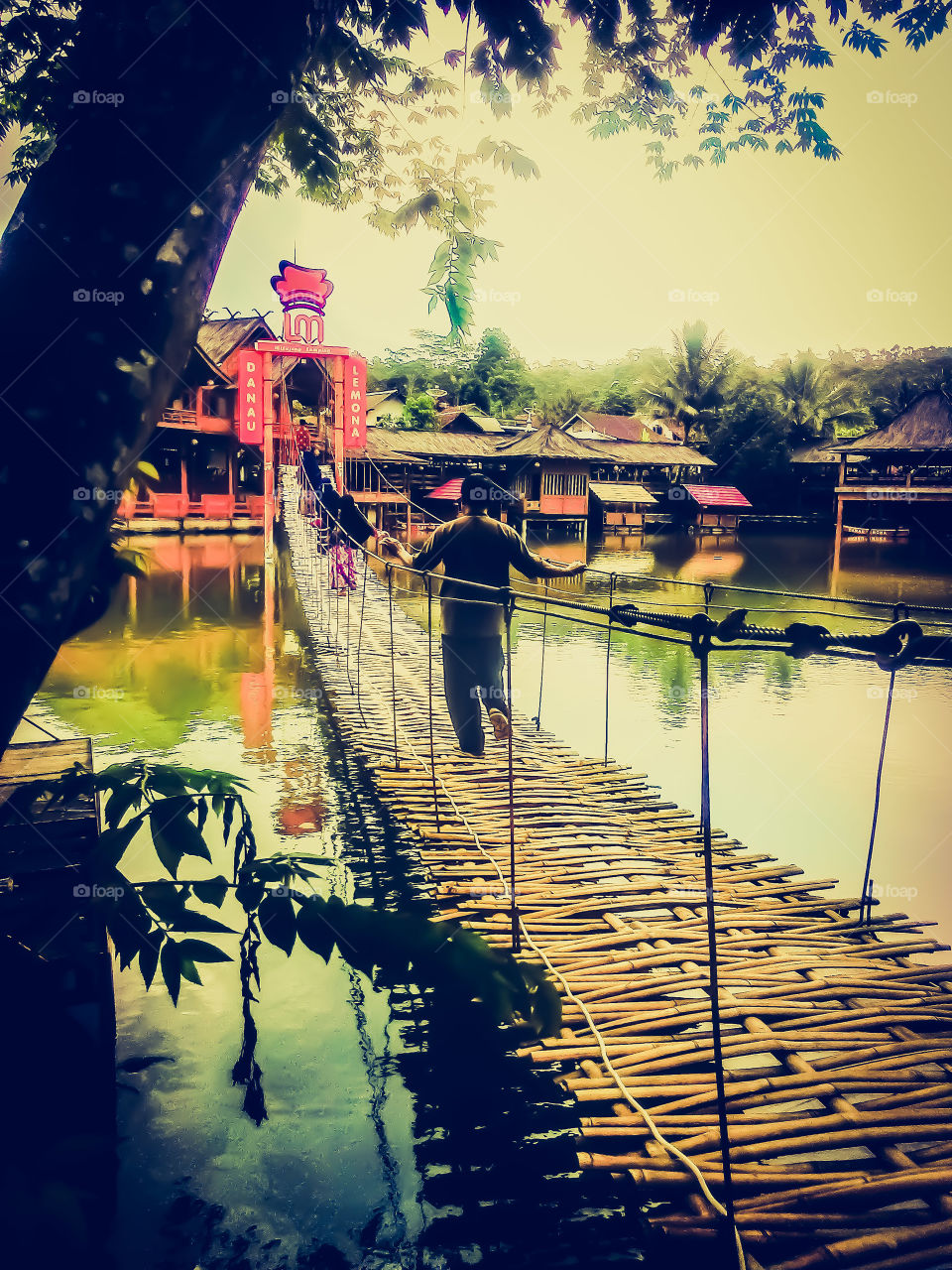 Bamboo bridge through the lake