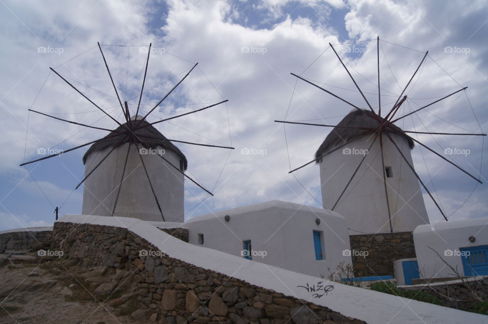 Mykonos windmills - the famous windmills located on the coast of Mykonos, Greece.  Out of season the propellers are tied down.