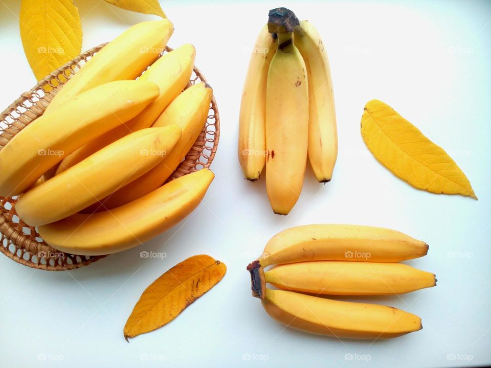 yellow bananas and yellow leaves