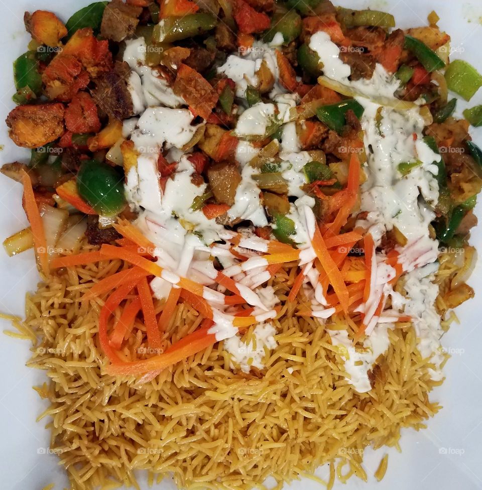 Mix gyro platter with rice and carrots
