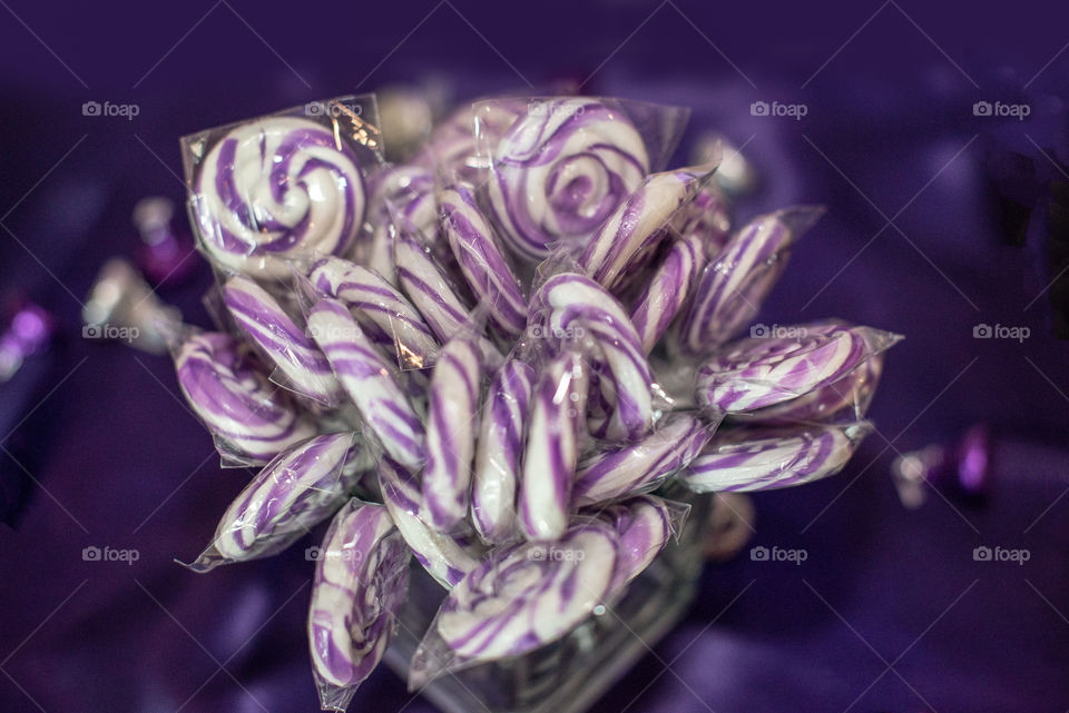 Round Grape Candy Swirl Lollipops in Candy Jar Top view