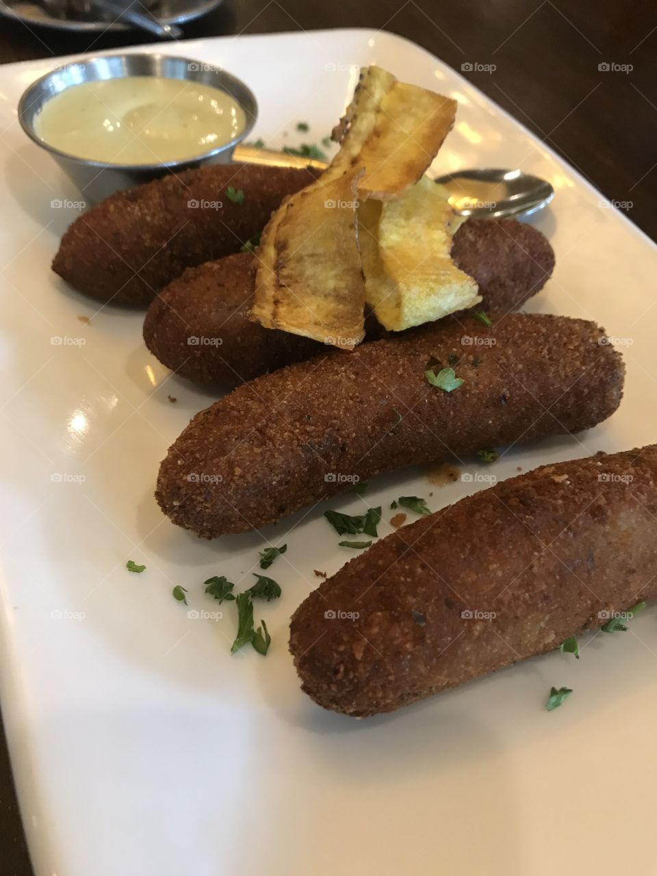 Cuban croquettes appetizer makes a good small meal starter with a cilantro dipping sauce