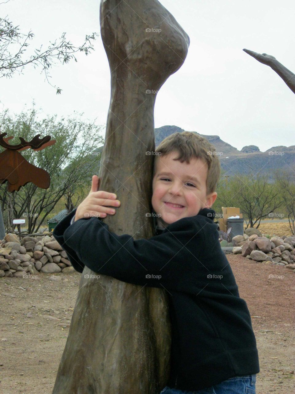 Hugging a sculpture