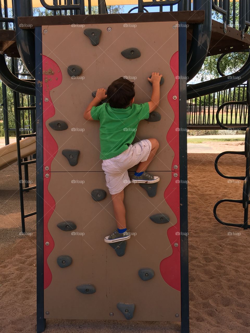 Boy on climbing wall