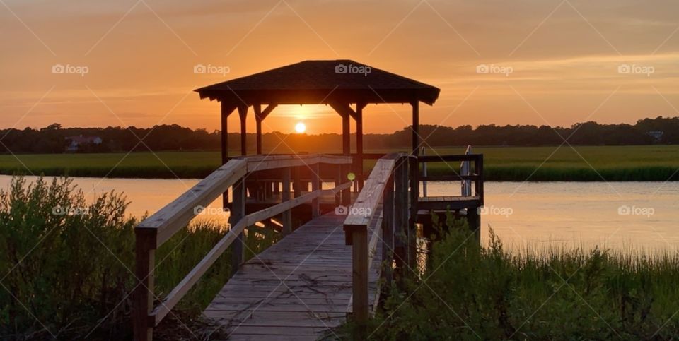 as we leave the beach my granddaughter captured this beautiful view of sunset over the salt marsh. I am trying to encourage her to join us!