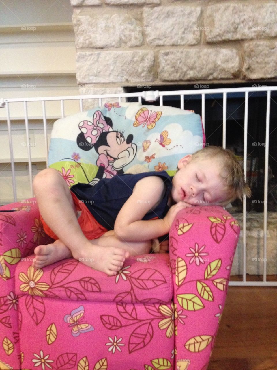 Toddler boy sleeping in child recliner