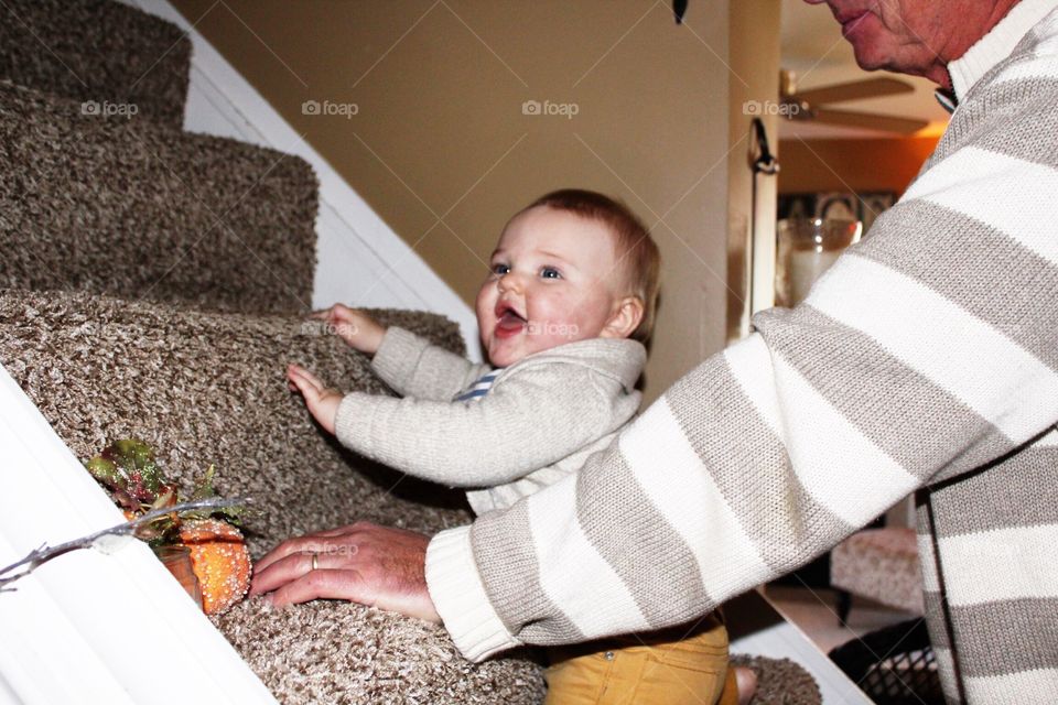 Playing on the steps with grandpa 