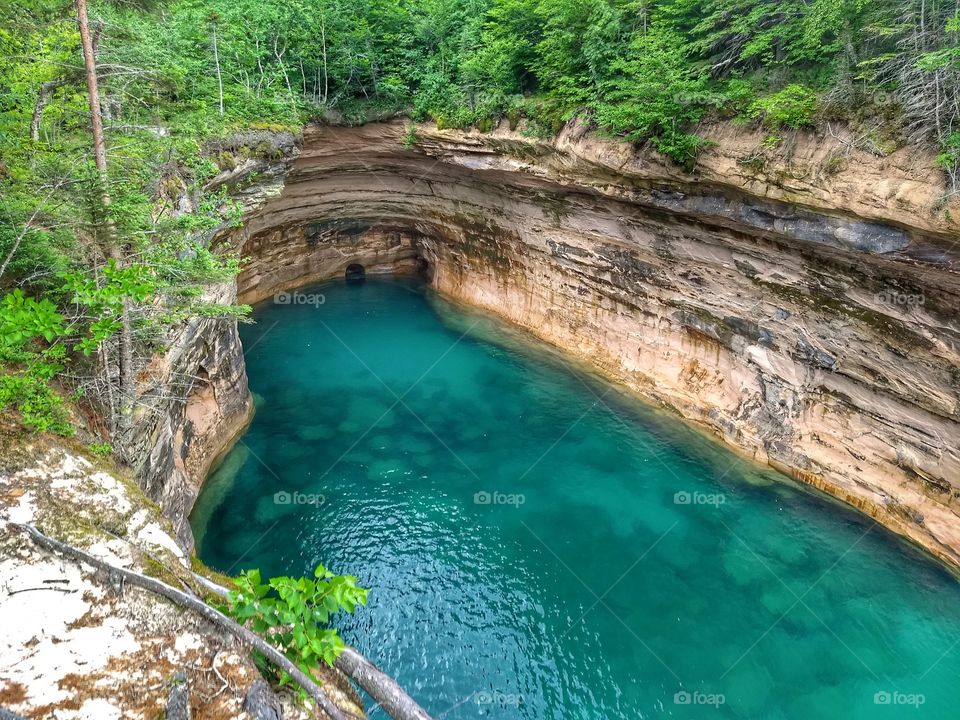Turquoise water cliffs surrounding