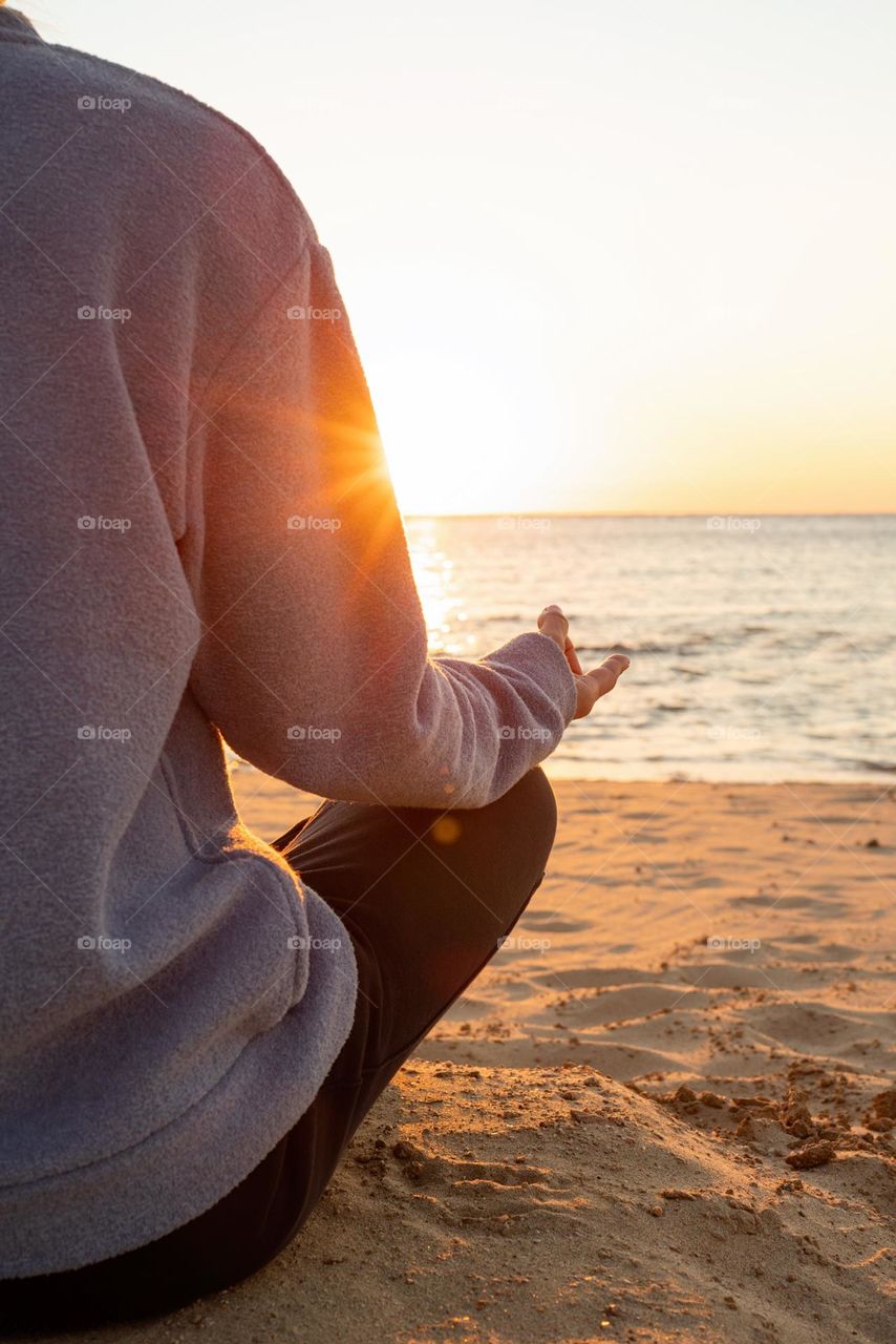 woman meditate in sunset