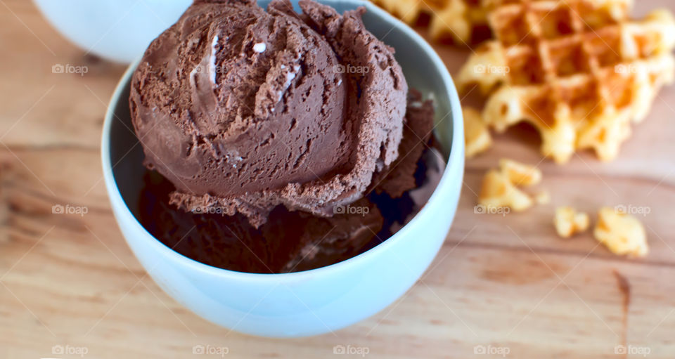 Two scoops of chocolate ice cream in bowl