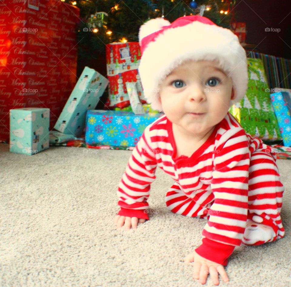 Portrait of a baby wearing santa hat