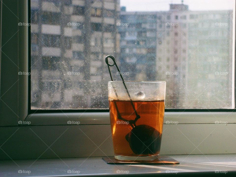 a cup of tea on the windowsill