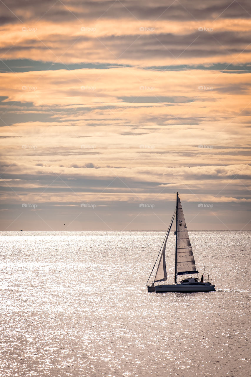 Yacht off the headland