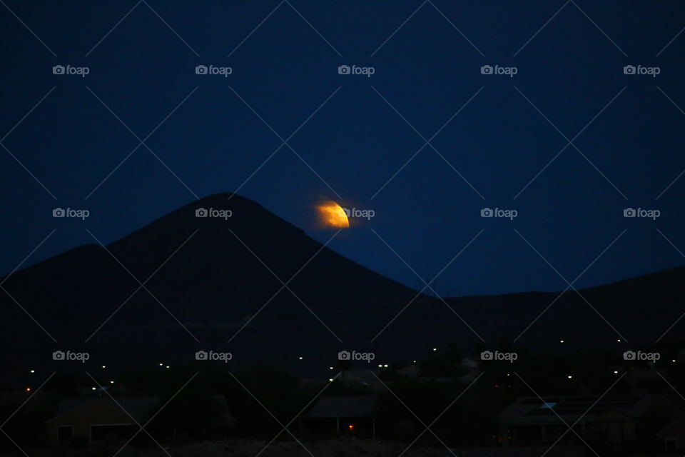 Cloud covered Blood Moon. Waiting for the eclipse of the Blood Moon on a cloudy night. The moon would peak out every now and then.