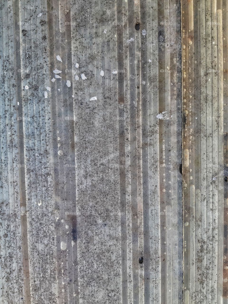 A close up texture of dirty plastic canopy.