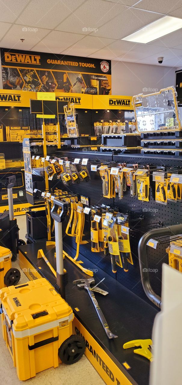 DeWalt brand tools in Authorized Dealer showroom or store. Candy store for a working man. Trademark color Yellow.