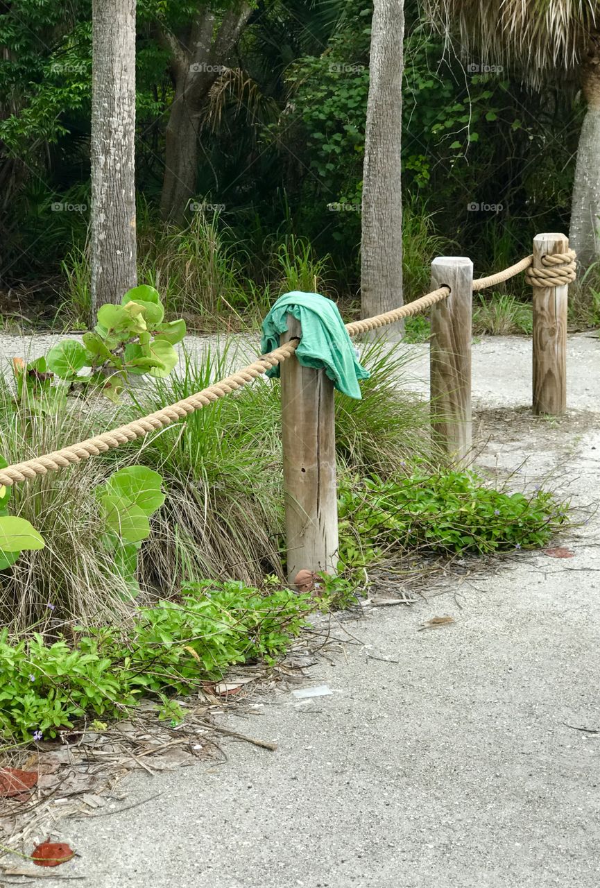 Forgotten green shirt on post