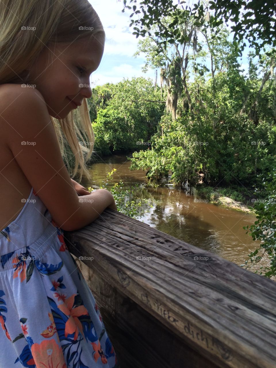 Little girl overlooking a river 