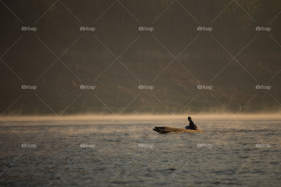 Boat in the river with mist