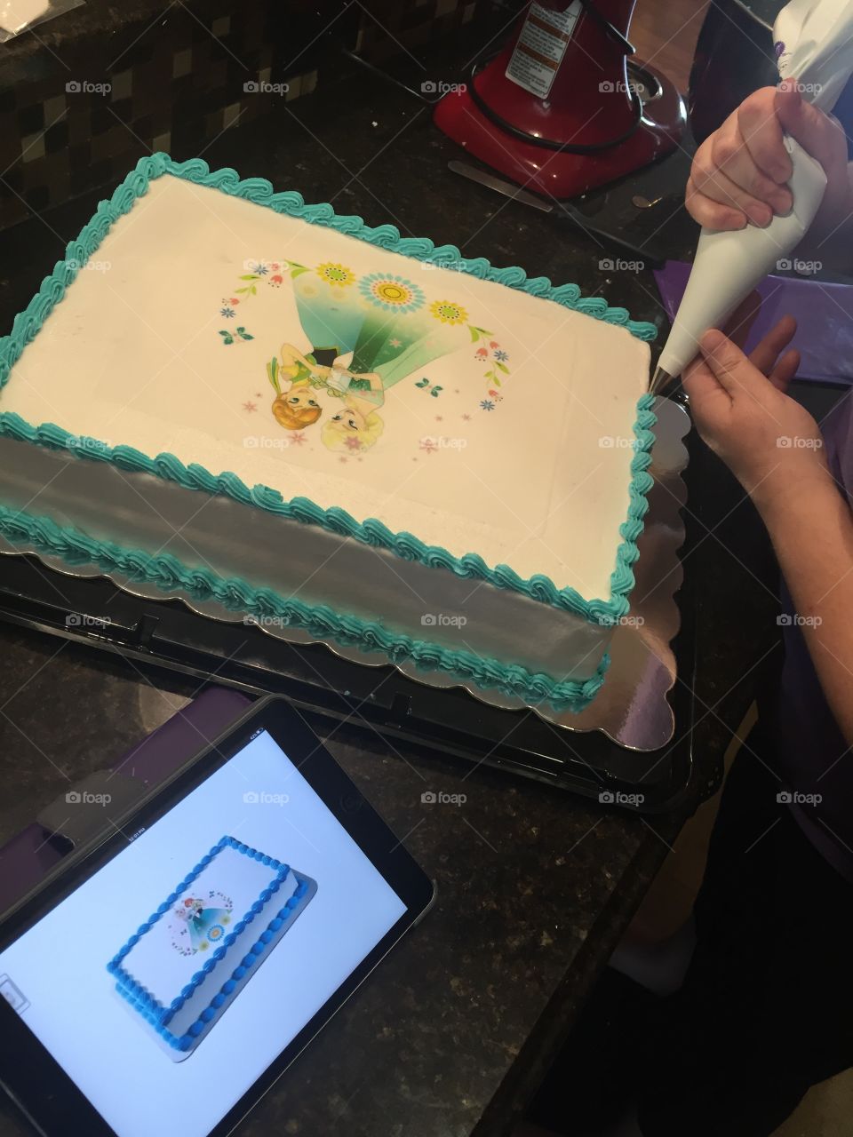 Decorating a birthday cake