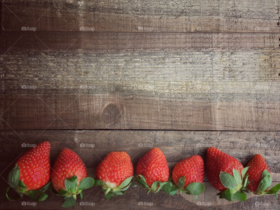 Row of strawberries on table