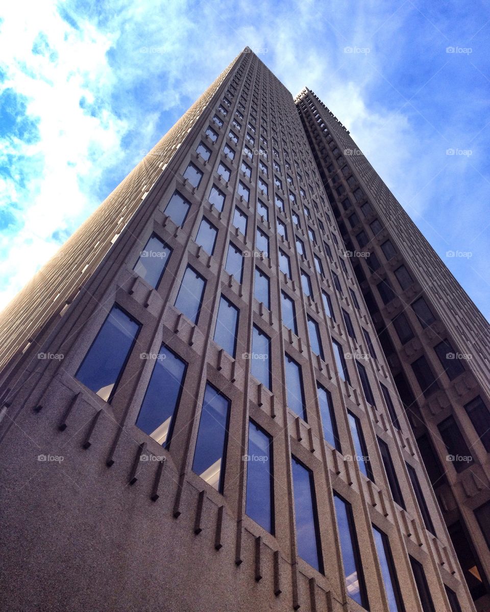 Skyscraper 2. A view looking up and the corner of a tall building against the sky. Taken with my iphone.
