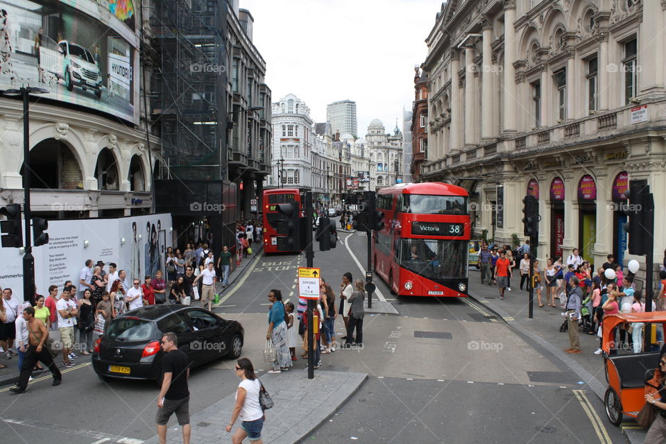 A narrow street in London full of activity 