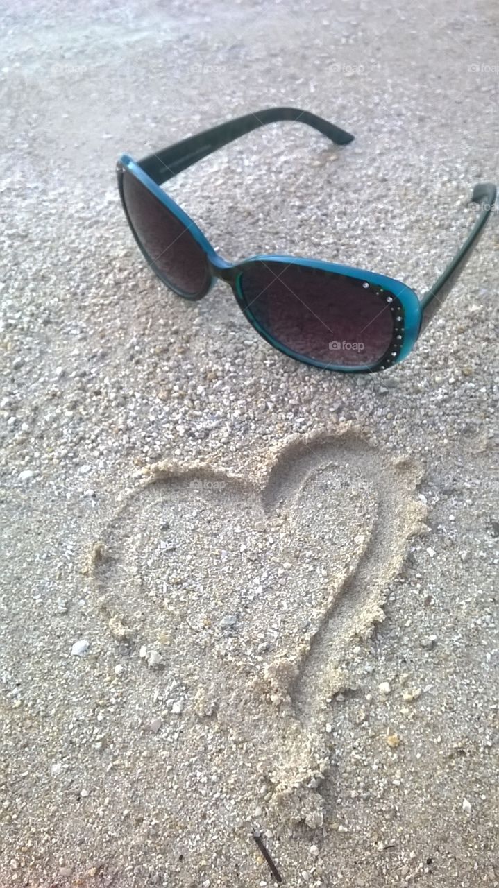 Sun glasses in the sand