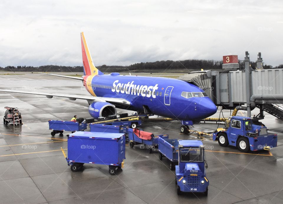 Southwest Airlines jet being serviced on the tarmac, preparing for a flight 