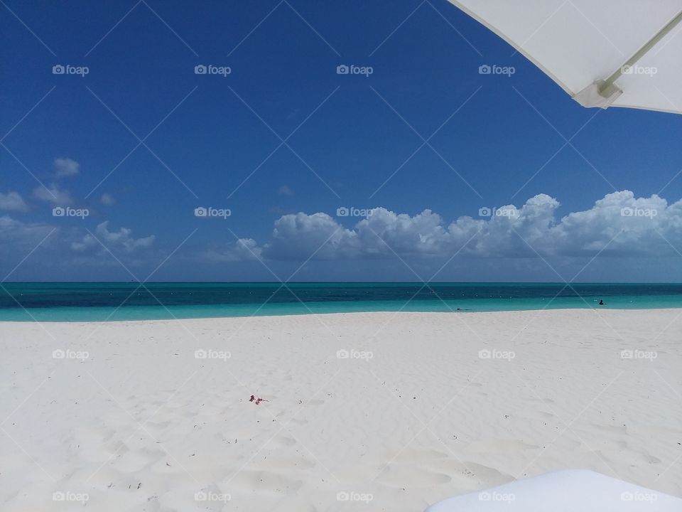 enjoying the view under umbrella