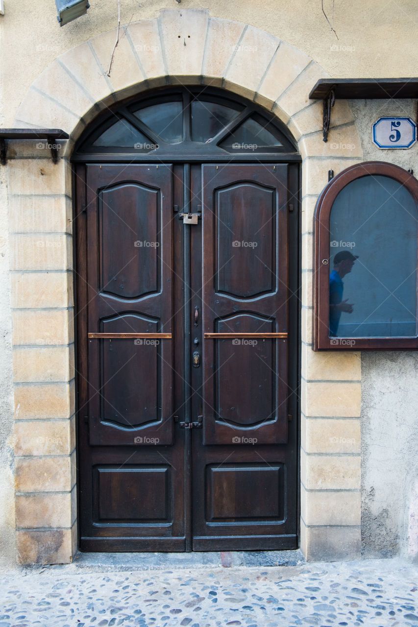 Old door in the city of Cefalu on Sicily.