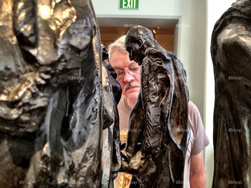 Museum visitor with Rodin sculptures