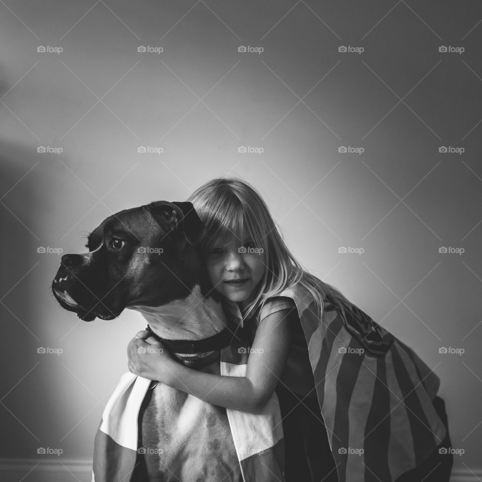 Girl and dog wearing capes