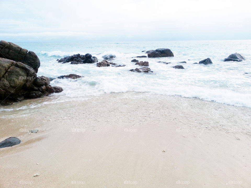 white sand cloudy blue sky beach(sea view), and with attractive rocks