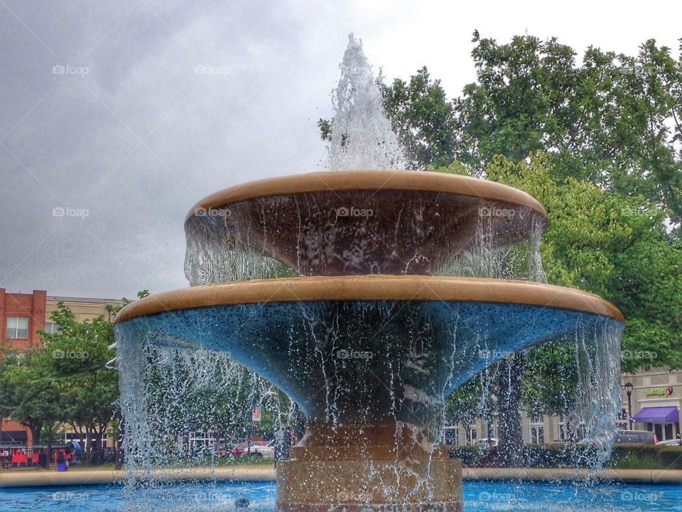 Peaceful sounds. Water fountain in a shopping center