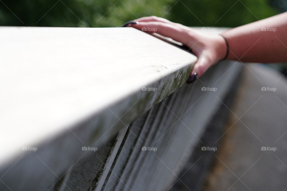Hand on railing 
