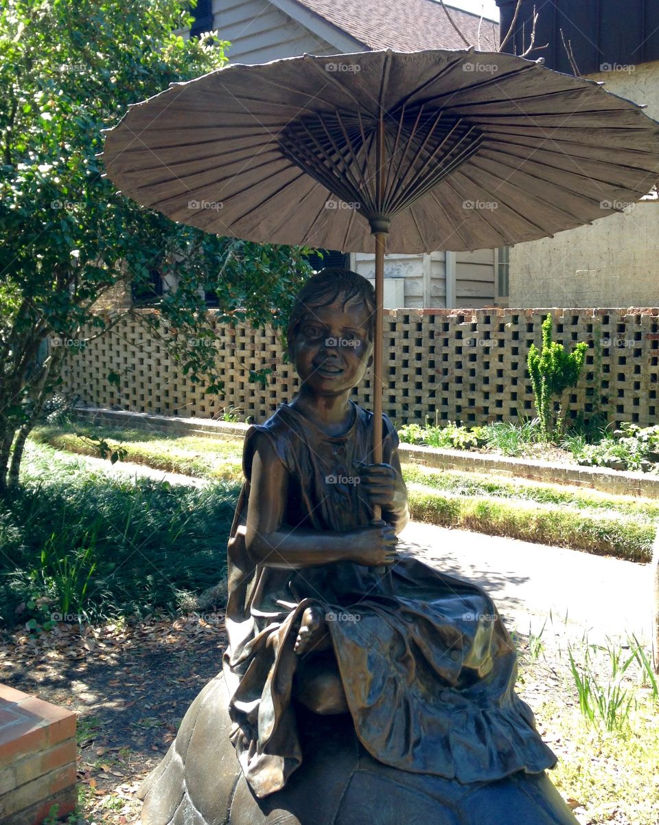 Woman with parasol bronze